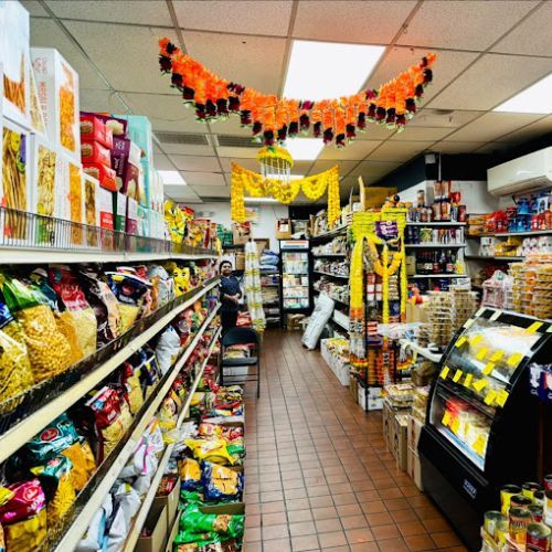 Inside the store — an aisle stocked with Indian snacks, spices and groceries
